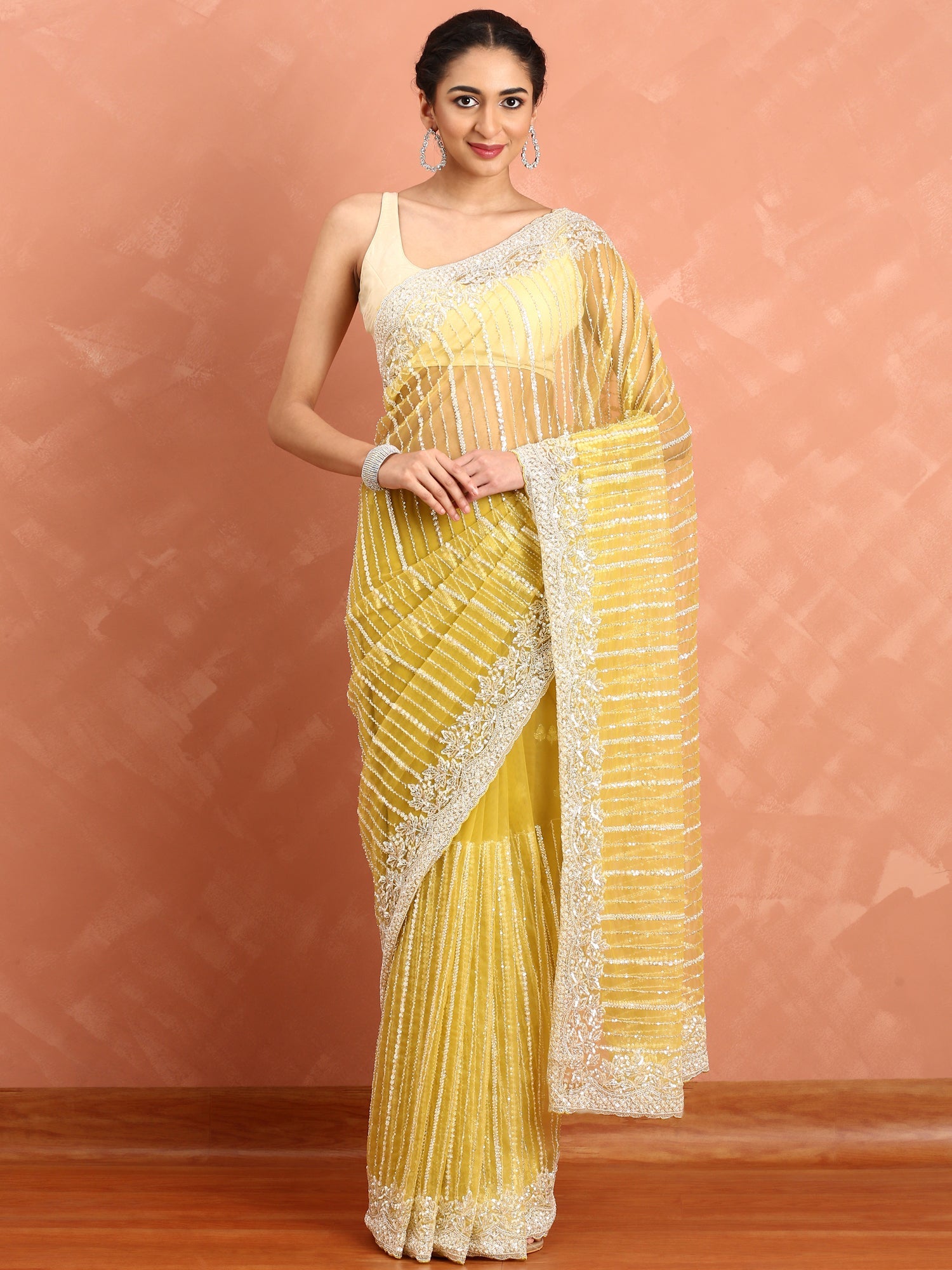Lime yellow net saree with cut Dana hand embroidery