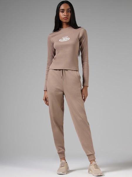 Buy Studiofit Beige Ribbed High-Waisted Joggers from Westside