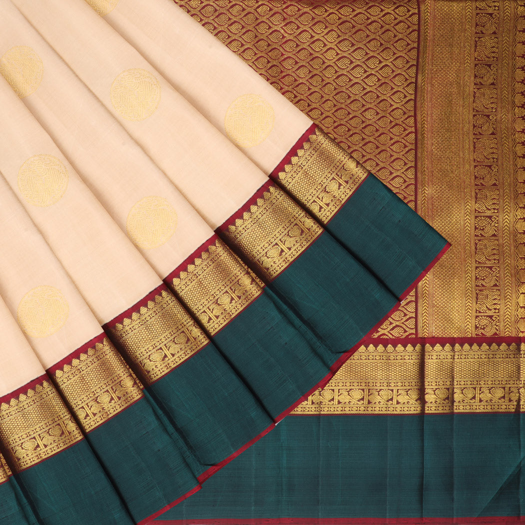 Green meenakari jacquard silksaree, contrast zari border of kuyil kann &  pallu of floral vine, mayil & zari stripes