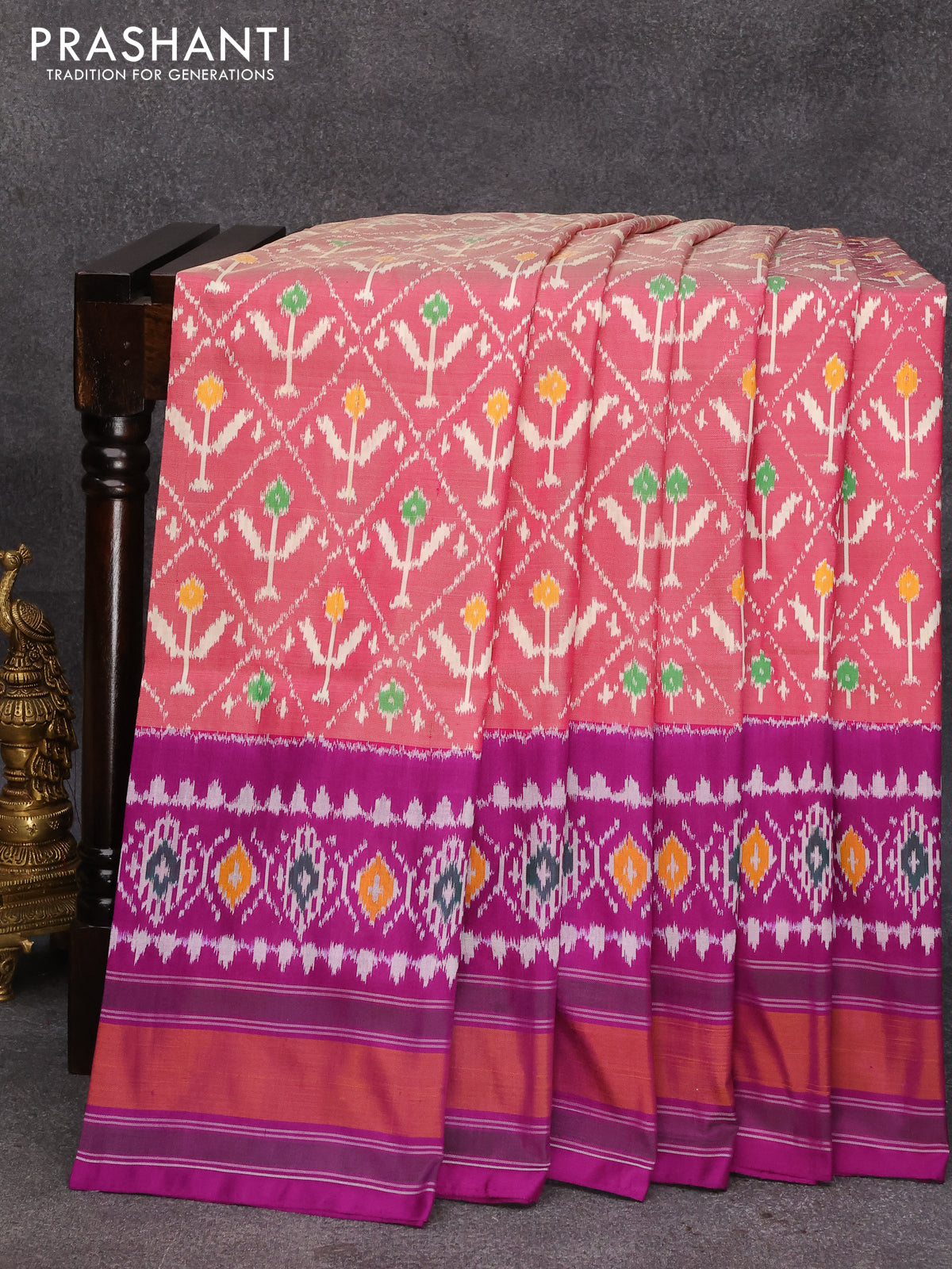 Pochampally ikkat gray with pink handwoven pure silk saree in floral design