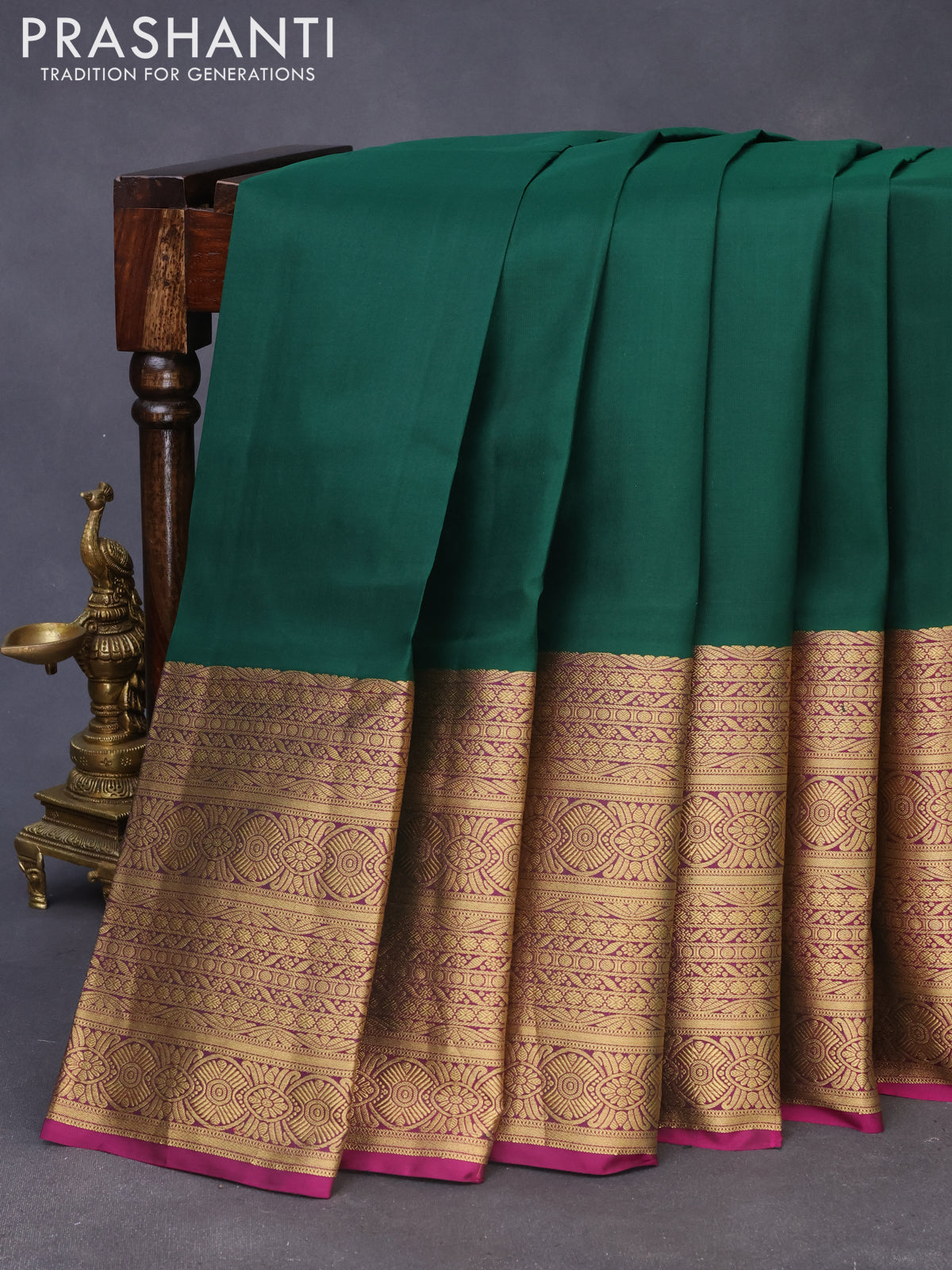 Pure kanchipuram silk saree bottle green and purple with plain body and long zari woven border