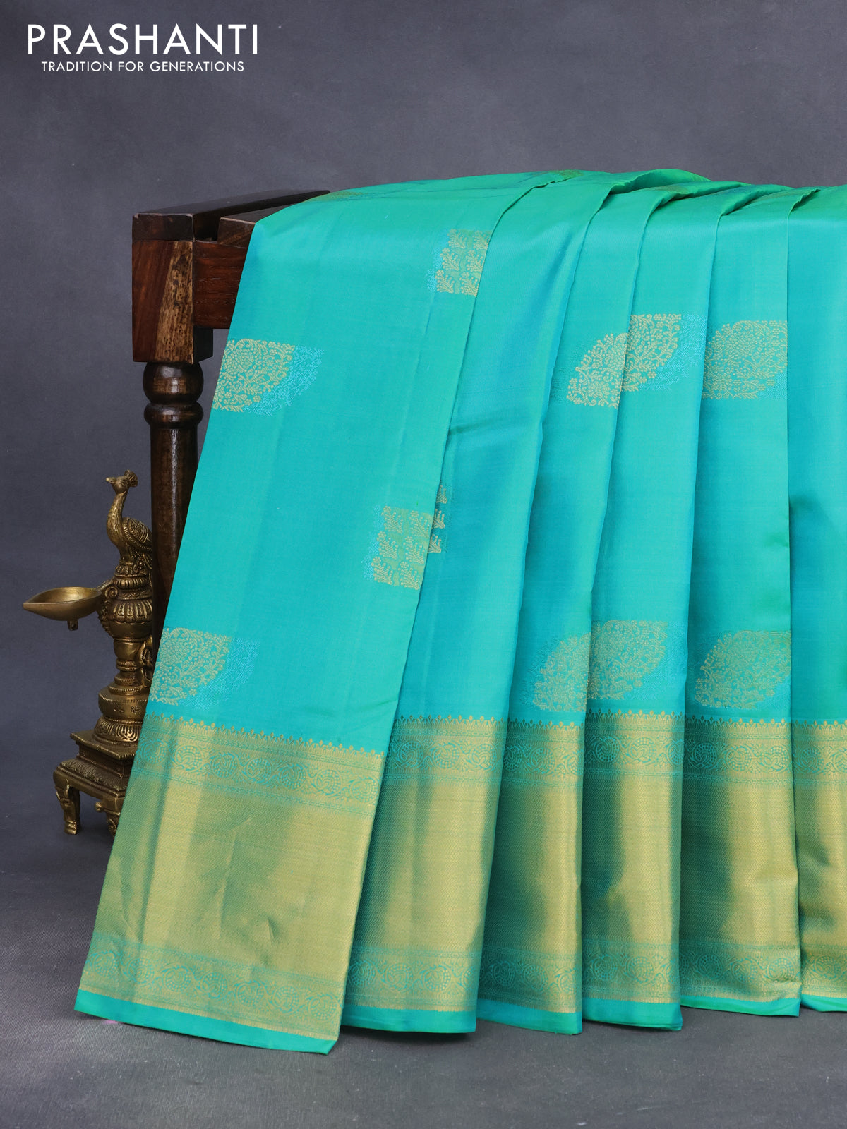 Pure kanchipuram silk saree dual shade of teal green with allover self emboss & buttas and rich zari woven border