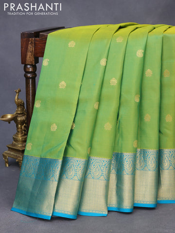 Pure kanchipuram silk saree light green and teal blue with zari woven buttas and zari woven border