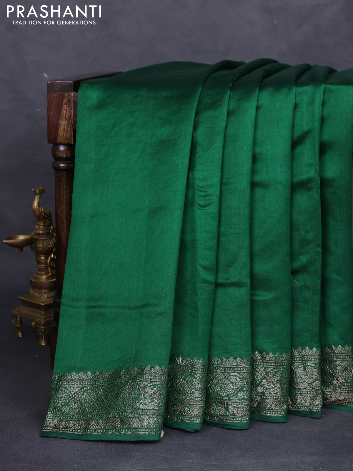 Chiniya silk saree green with plain body and woven border