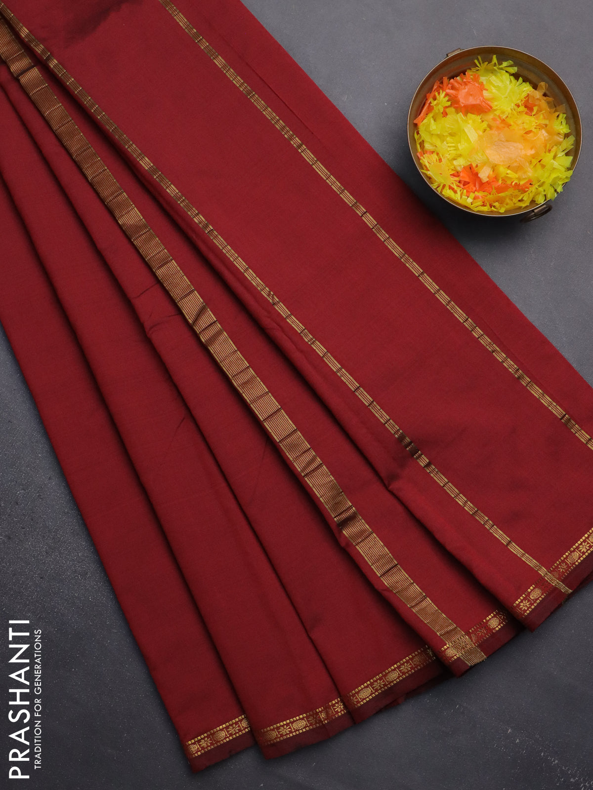 Arani semi silk saree maroon shade with plain body and small zari woven border