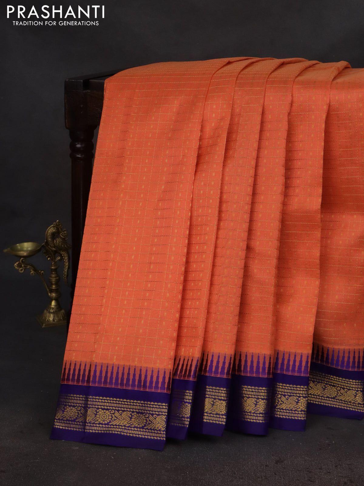 Kuppadam silk cotton saree peach orange and blue with allover small zari checks & lakshadeepam weaves and temple design zari woven border