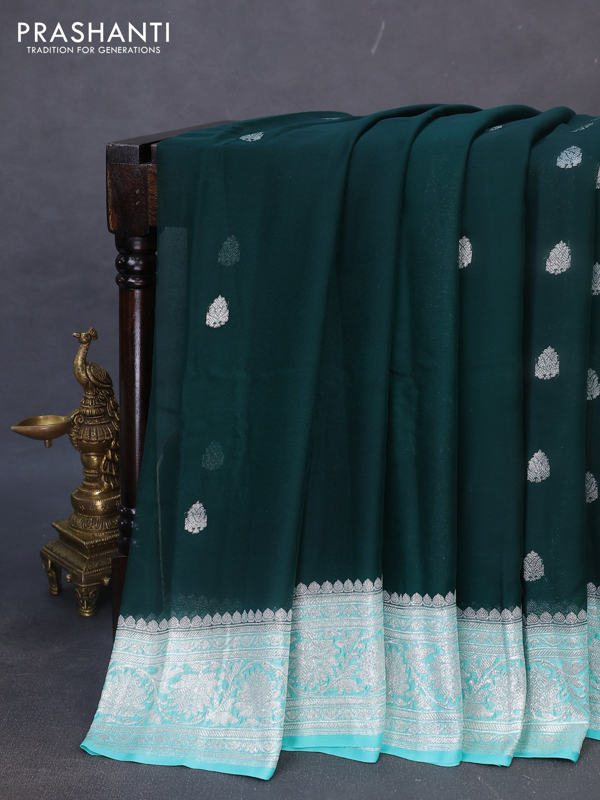 Banarasi chiffon silk saree bottle green and teal blue with silver zari woven buttas and silver zari woven border