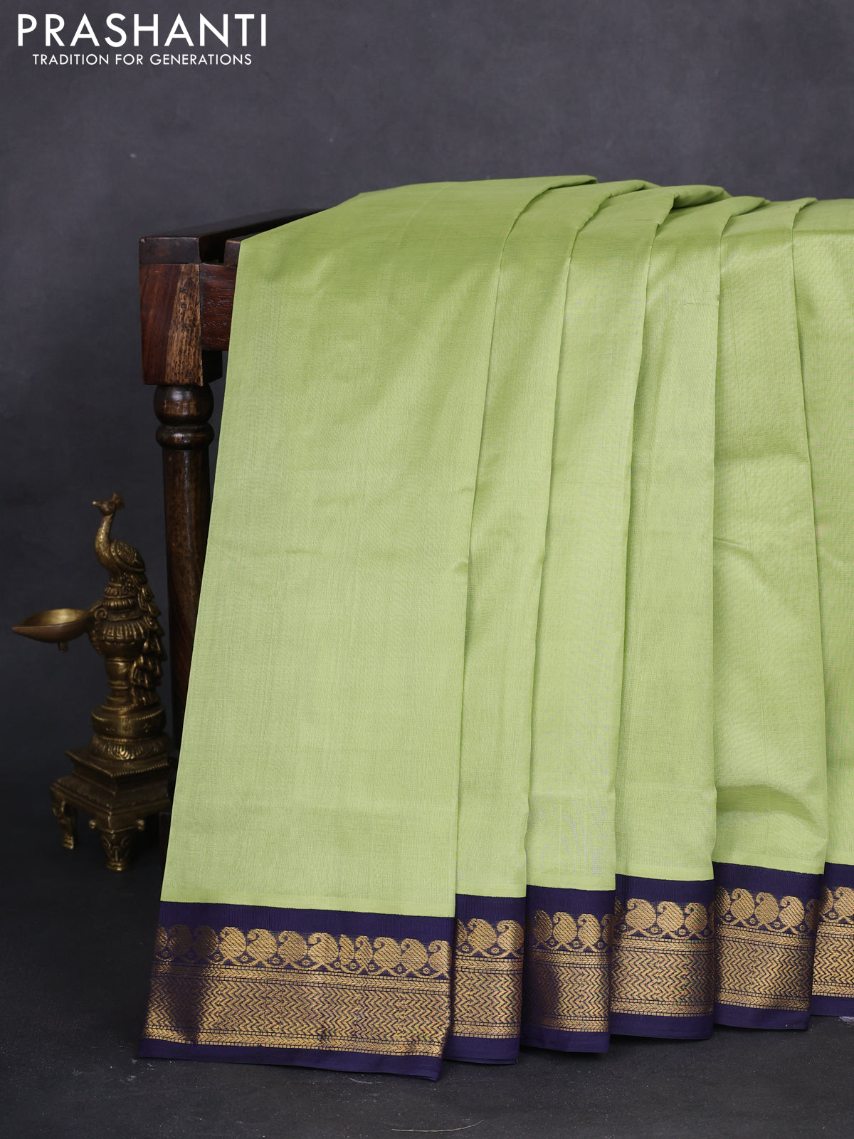 10 yards silk cotton saree pista green and navy blue with plain body and zari woven border