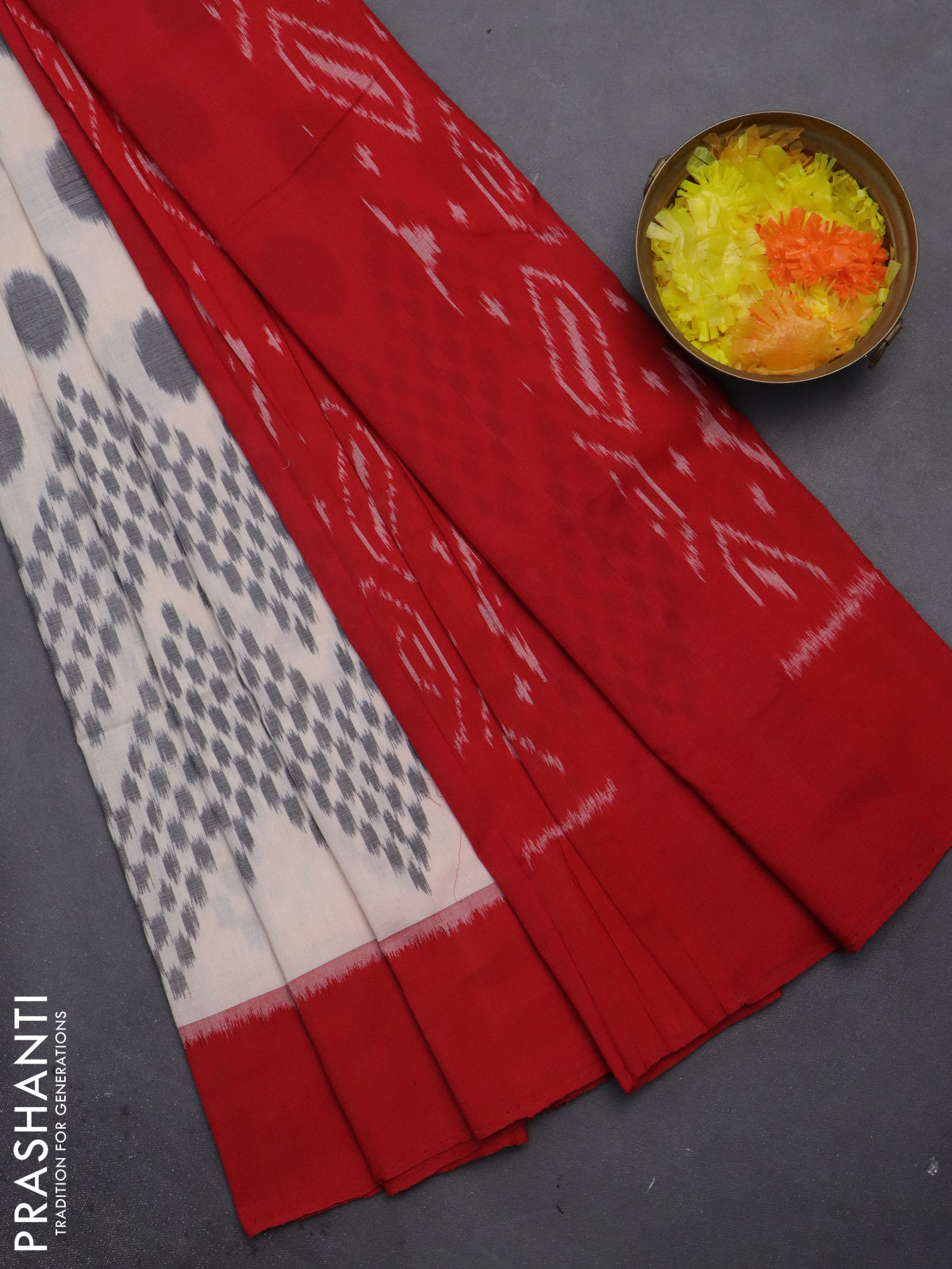 Ikat cotton saree off white and red with allover ikat butta weaves and simple border