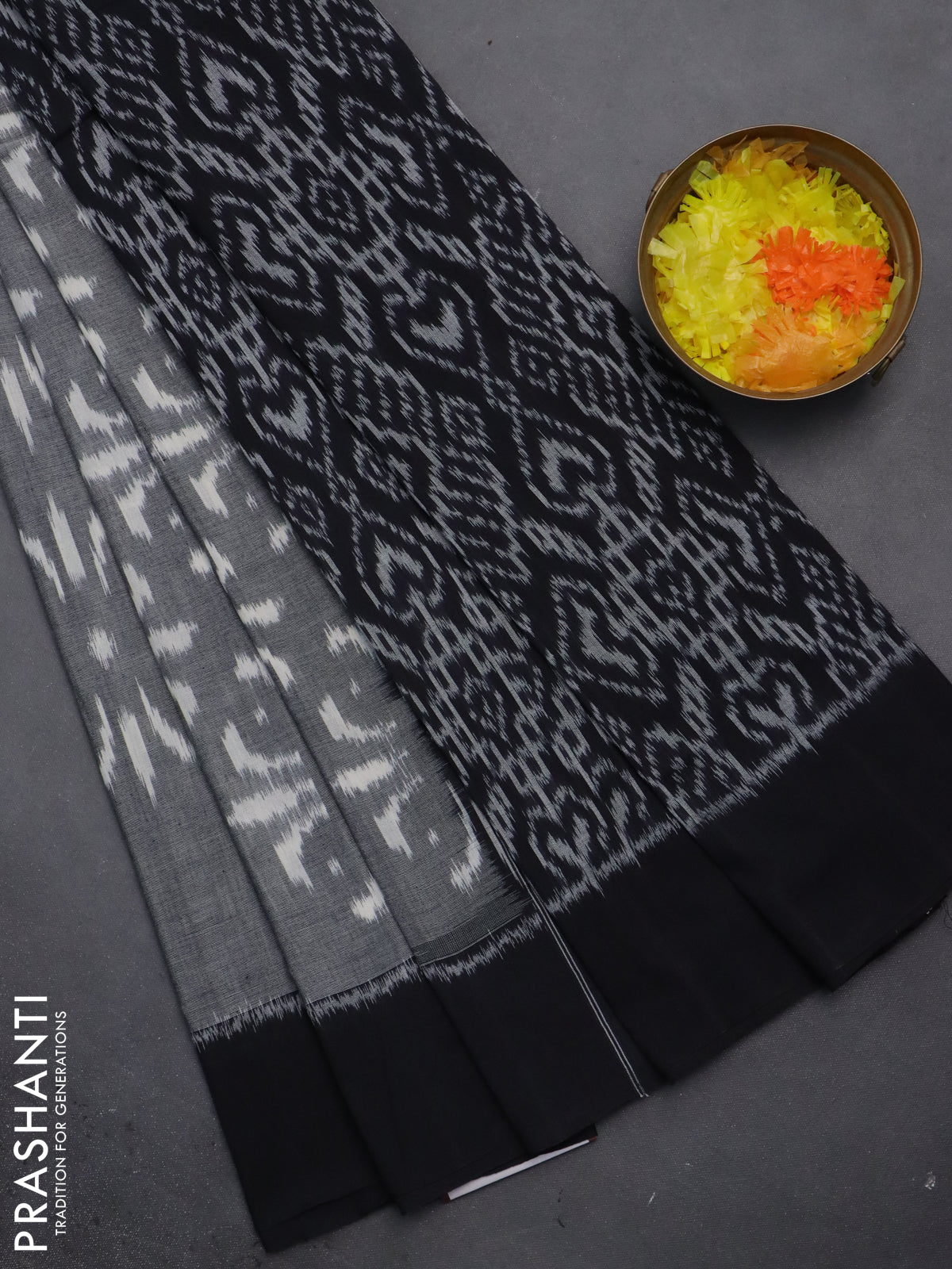 Ikat cotton saree grey and black with allover ikat weaves and simple border