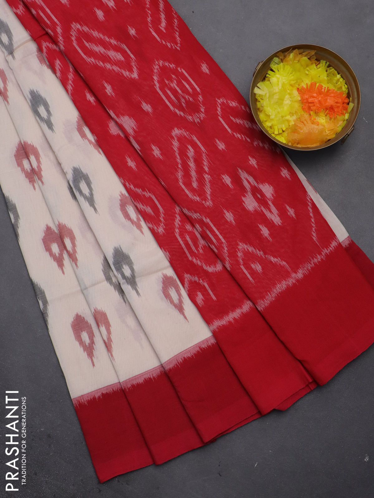 Ikat cotton saree cream and red with allover ikat butta weaves and long ikat style border
