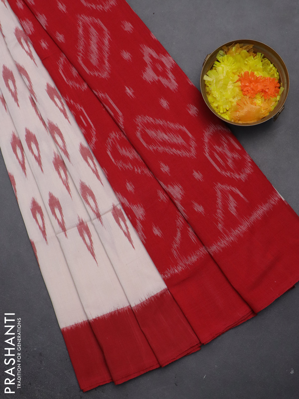 Ikat cotton saree cream and green red with allover ikat butta weaves and long ikat style border