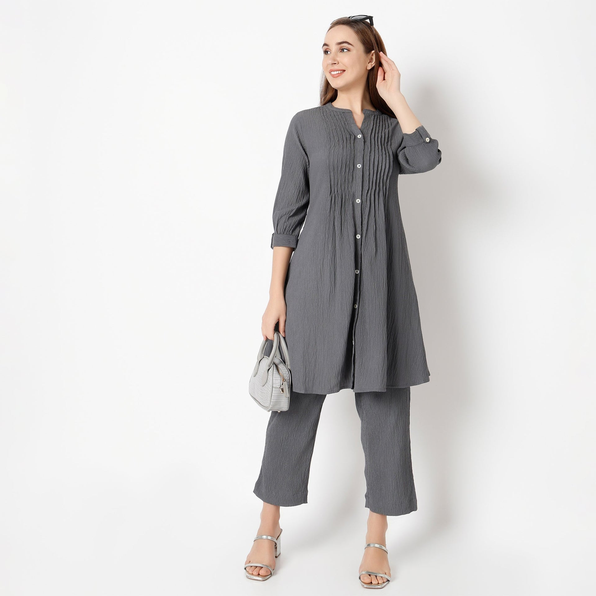 Band Collar Knee Length Three-Fourth Sleeve Flare Fit Solid Kurta With Pant Set