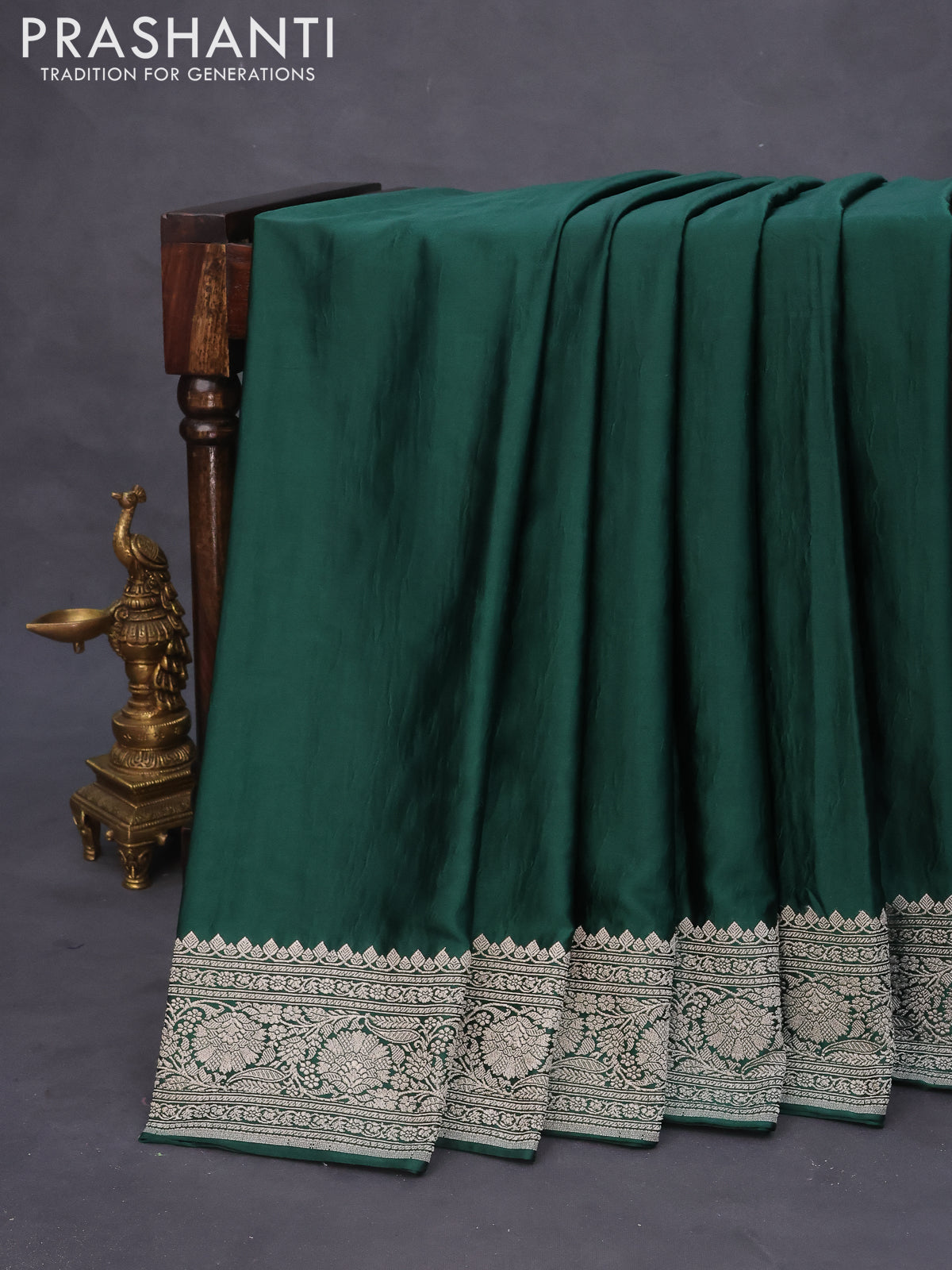 Banarasi crush crepe saree dark green with plain body and zari woven border