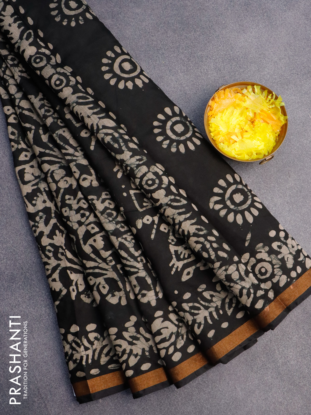 Muslin cotton saree black with allover batik prints and small zari woven border