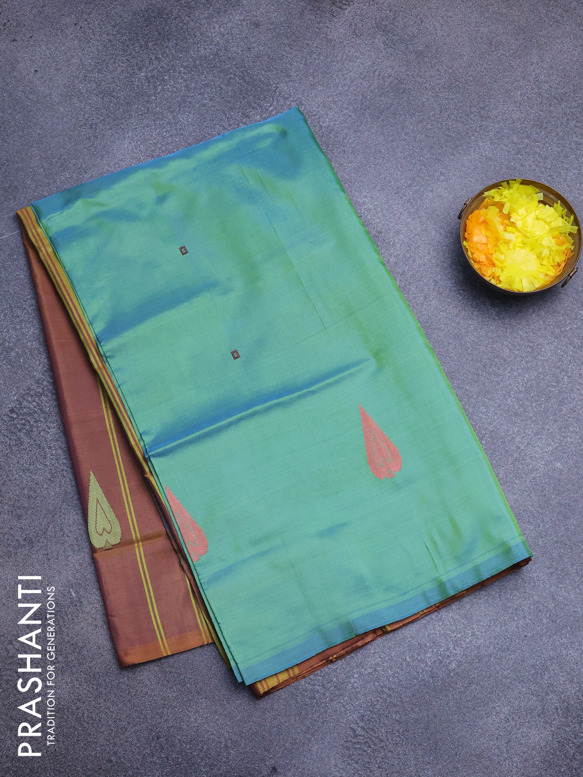 Banana pith saree dual shade of greenish blue and honey shade with thread woven buttas in borderless style