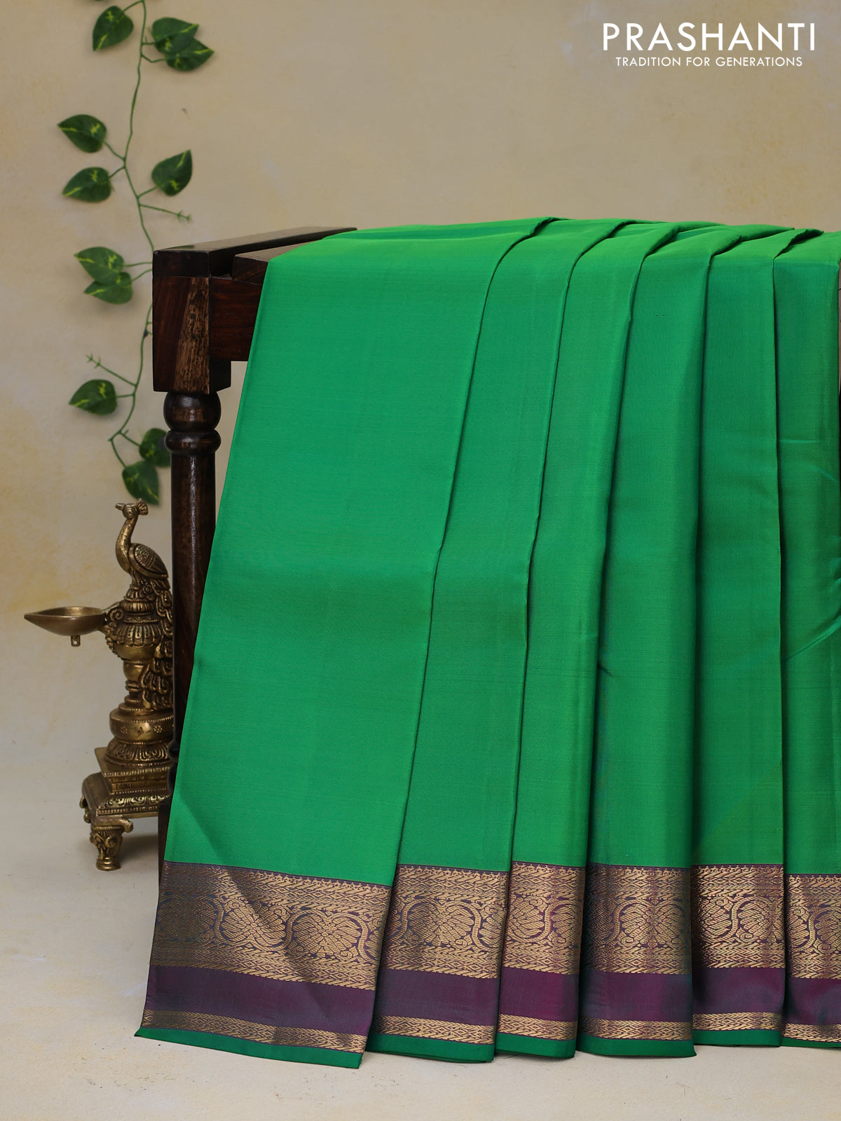 Pure kanjivaram silk saree green and dual shade of magenta pink with plain body and rettapet zari woven border