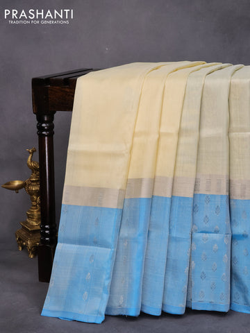 Pure uppada silk saree cream and cs blue with silver zari woven buttas and long silver zari woven butta border