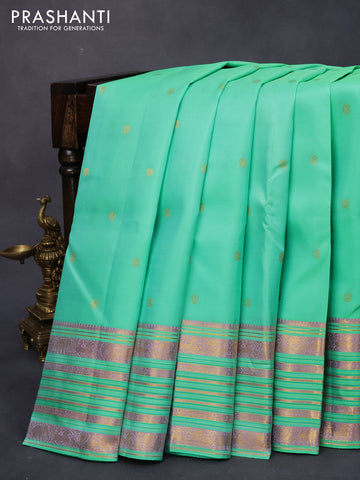 Pure kanjivaram silk saree teal green with allover zari woven buttas and zari woven border