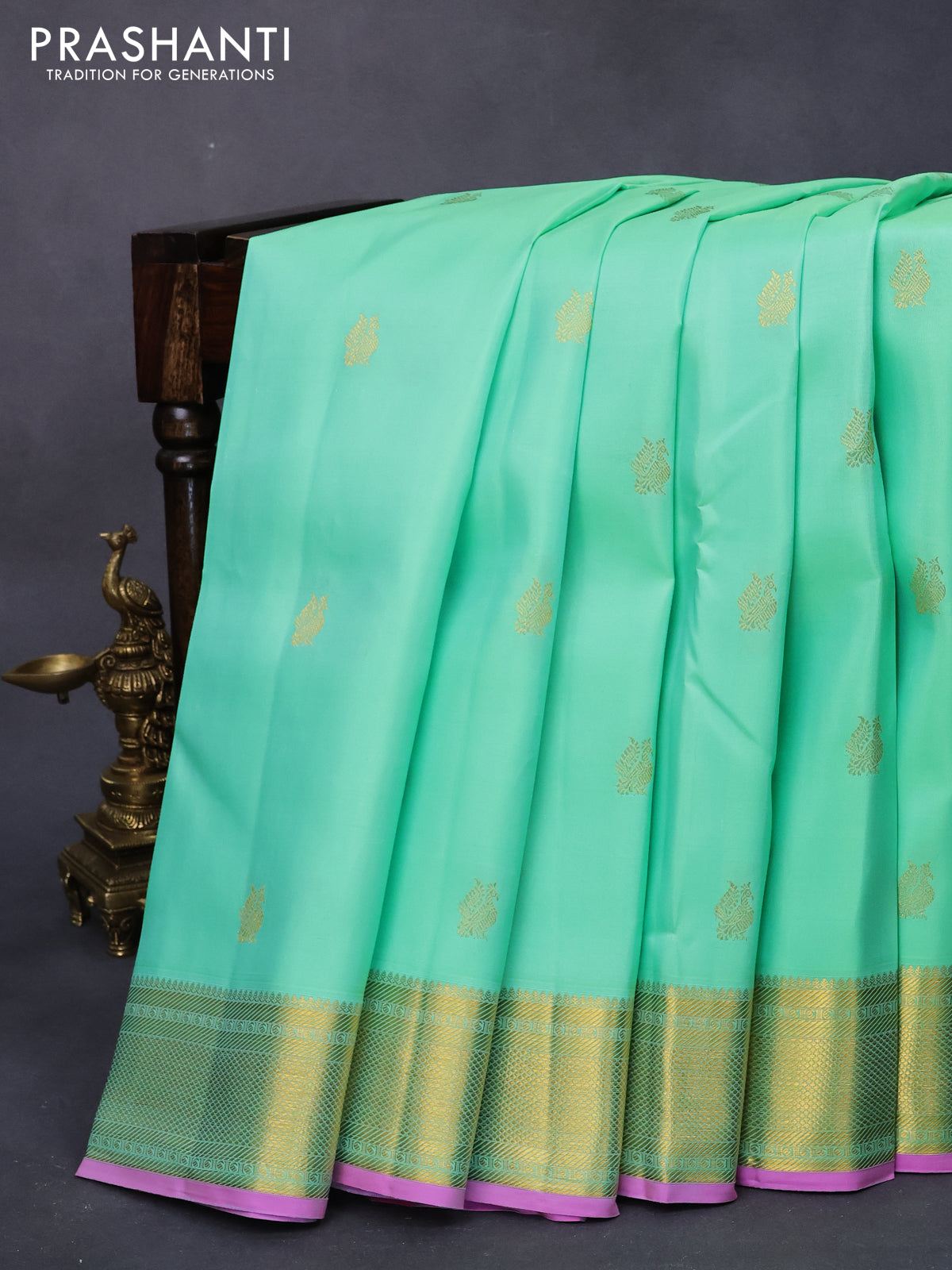 Pure kanjivaram silk saree teal green shade and pink with annam zari woven buttas and zari woven border