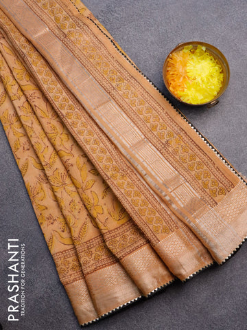 Chanderi silk cotton saree pale orange and black with natural vegetable prints and zari woven gotapatti lace border