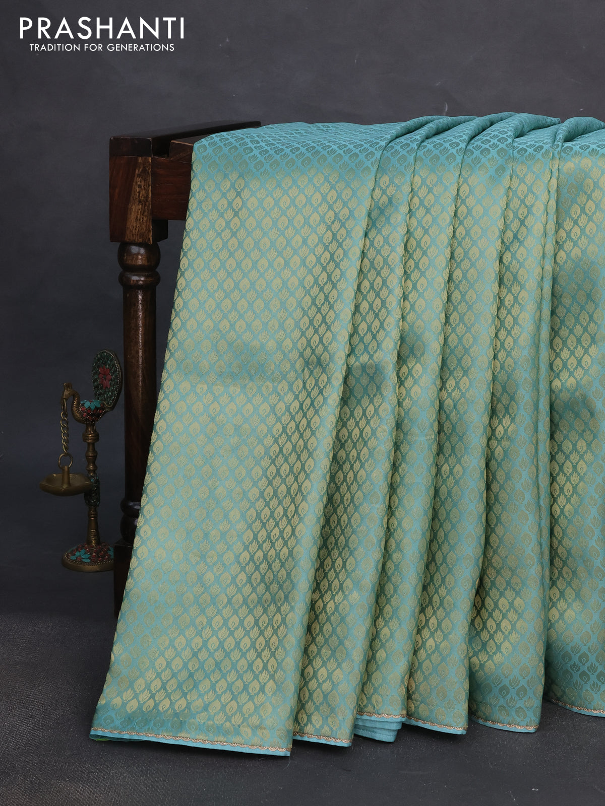 Banarasi semi crepe saree teal blue shade with allover zari woven brocade weaves and lace work border