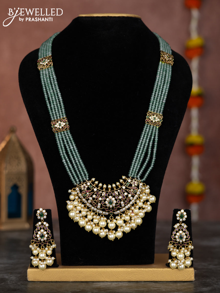 Beaded multilayer mint green necklace with kemp & cz stones and pearl hangings in victorian finish