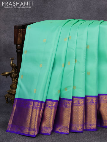 Pure kanjivaram silk saree teal green shade with annam & rudhraksha zari woven buttas and rich zari woven ganga jamuna border butta style