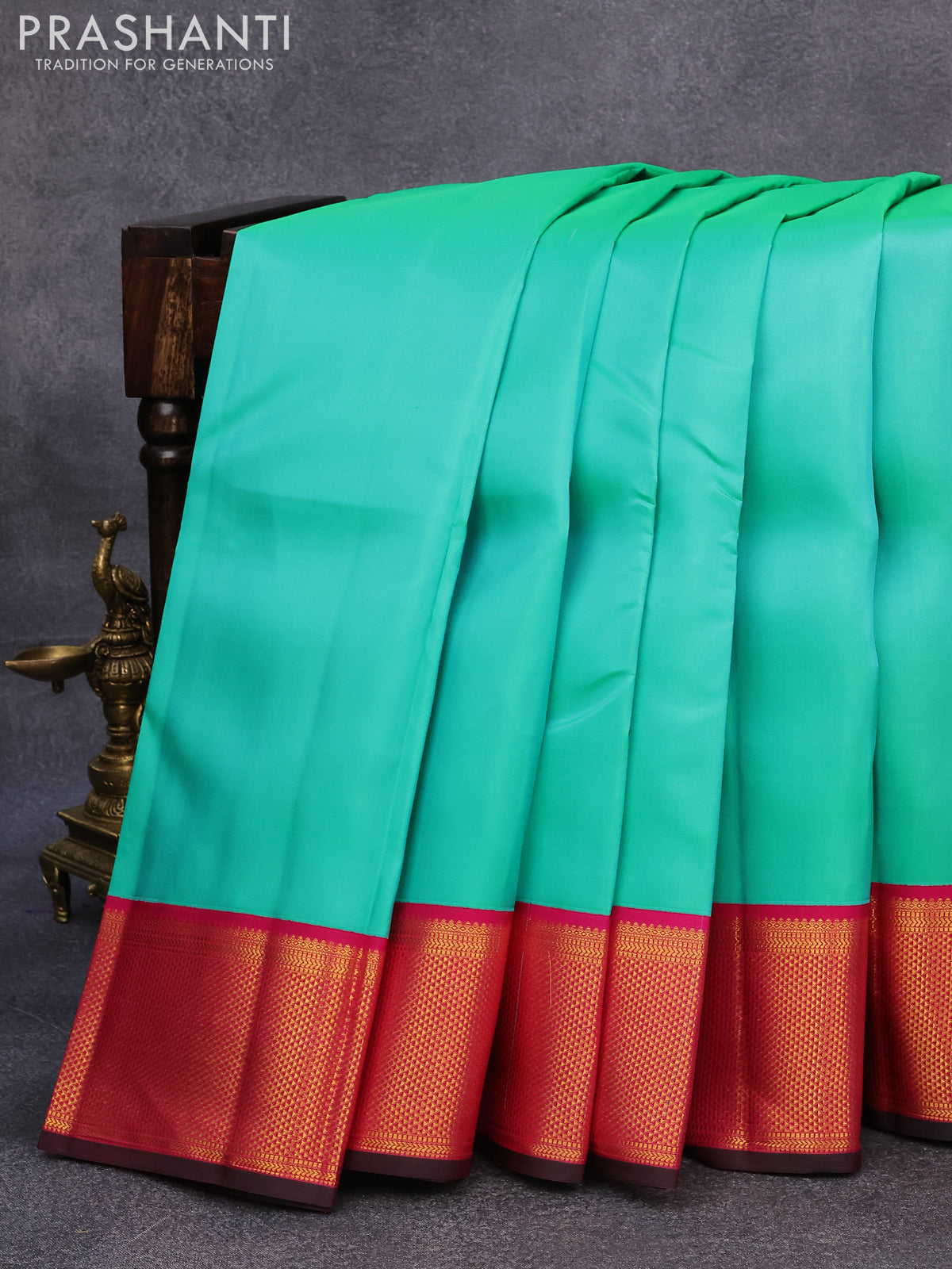 Pure kanjivaram silk saree teal green and pink with plain body and rich zari woven border plain body