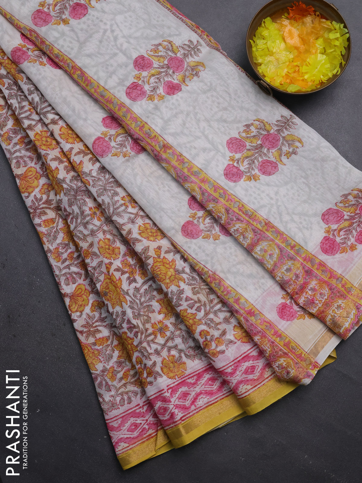 Chanderi bagru saree off white and yellow with allover floral prints and small zari woven border