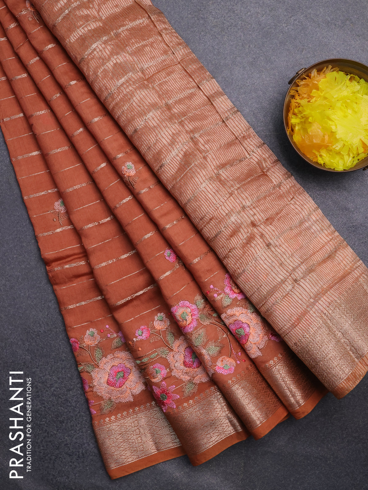 Assam silk saree rust shade with allover zari weaves & floral embroidery work buttas and zari woven border