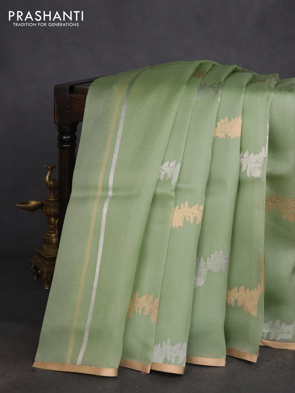Banarasi organza silk saree pastel green with silver & gold zari weaves and zari woven piping boder