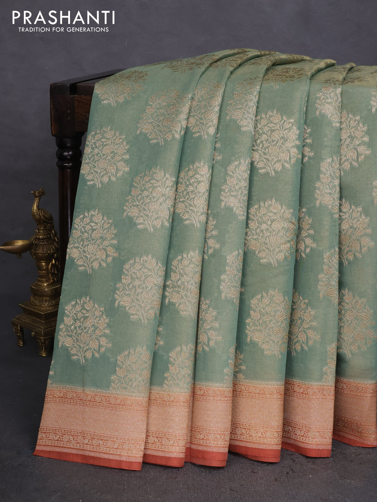 Banarasi tissue silk cotton saree pastel green and rust shade with allover thread & zari woven butta weaves and woven border