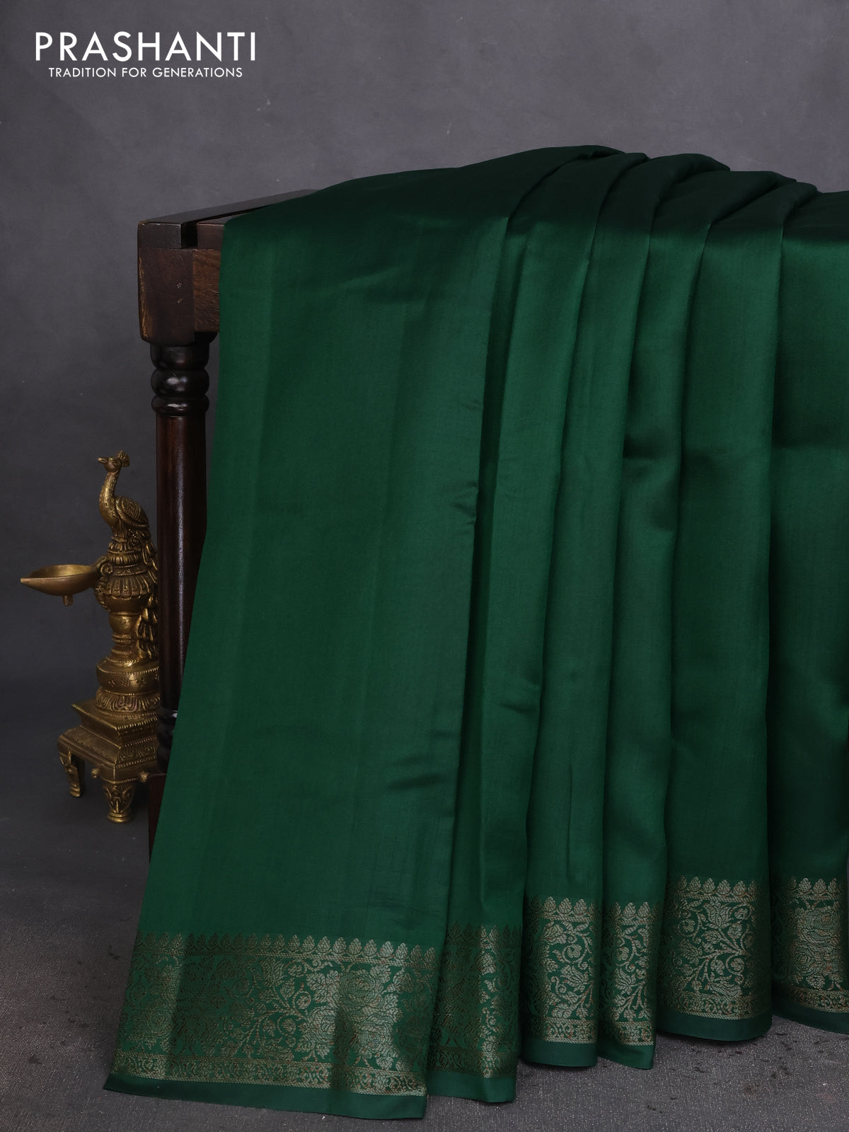 Chiniya silk saree green and rust shade with plain body and woven border