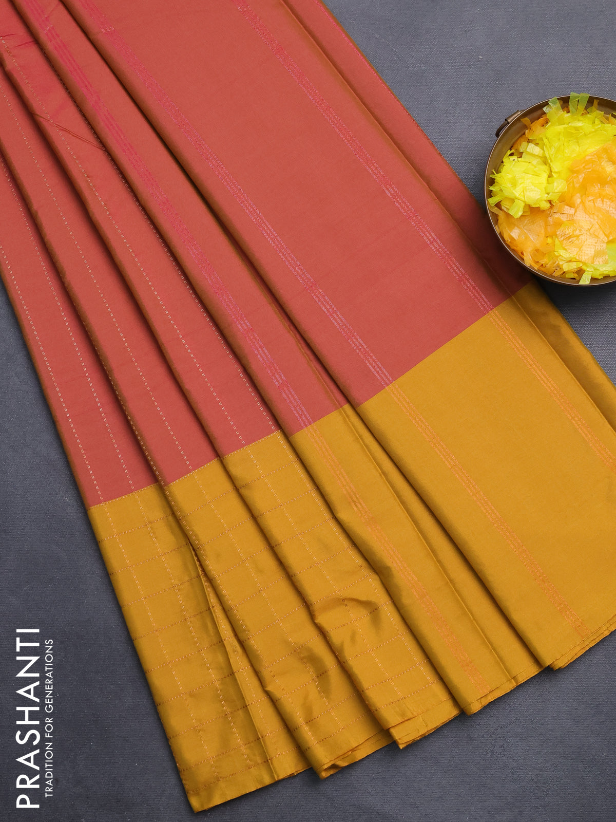Arani semi silk saree dual shade of pink and dark mustard with allover copper zari weaves and zari checked border
