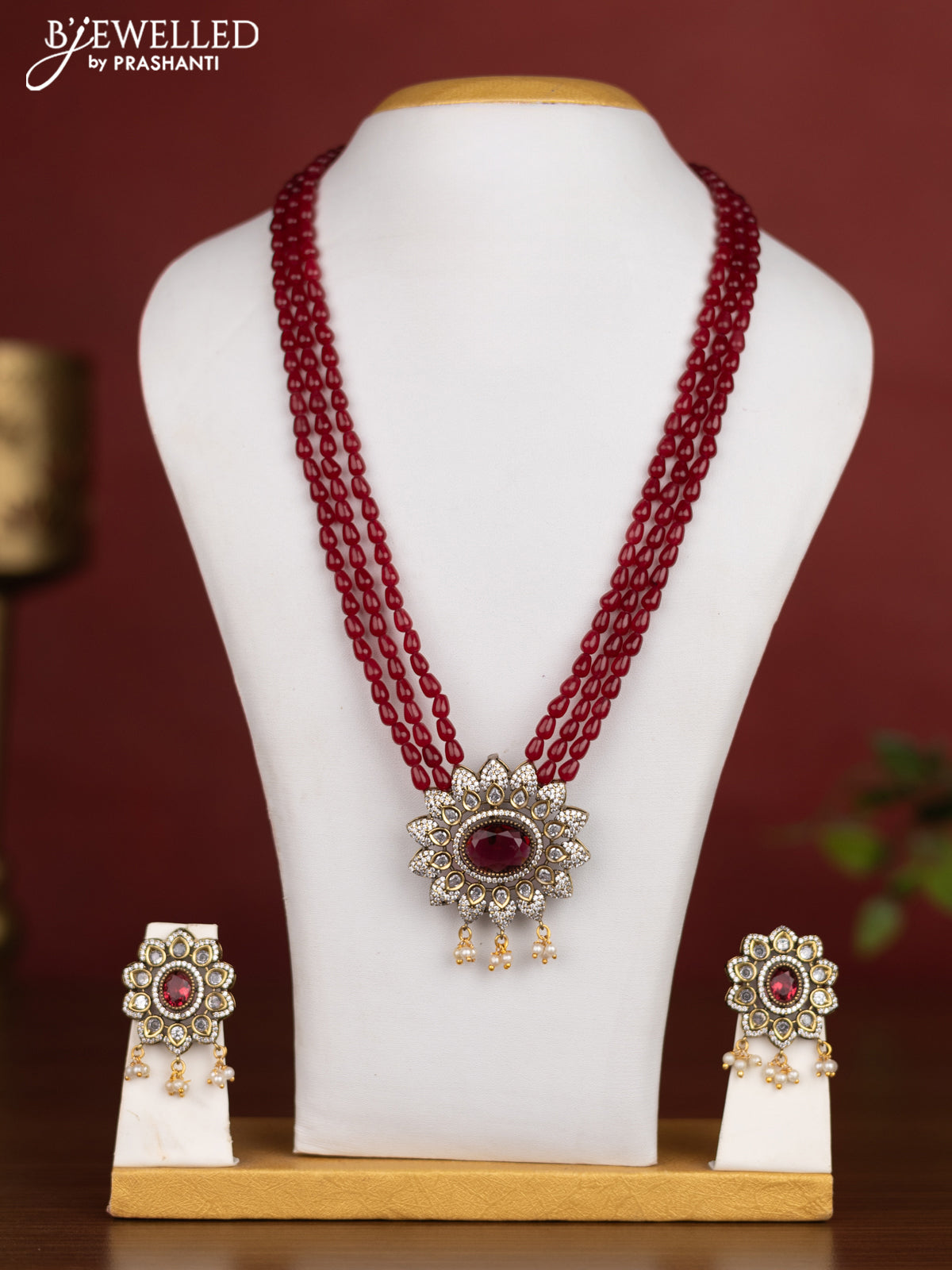 Beaded triple layer maroon necklace with ruby & cz stones and pearl hangings in victotrian finish