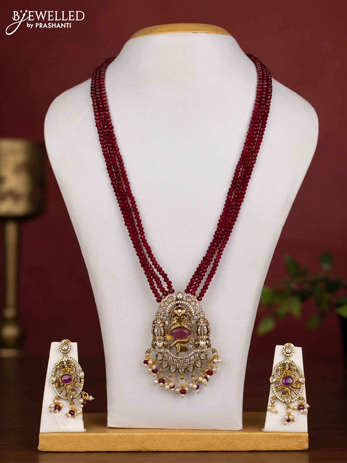 Beaded triple layer maroon necklace ganesha pendant with ruby & cz stones and pearl & beads hanging in victorian finish
