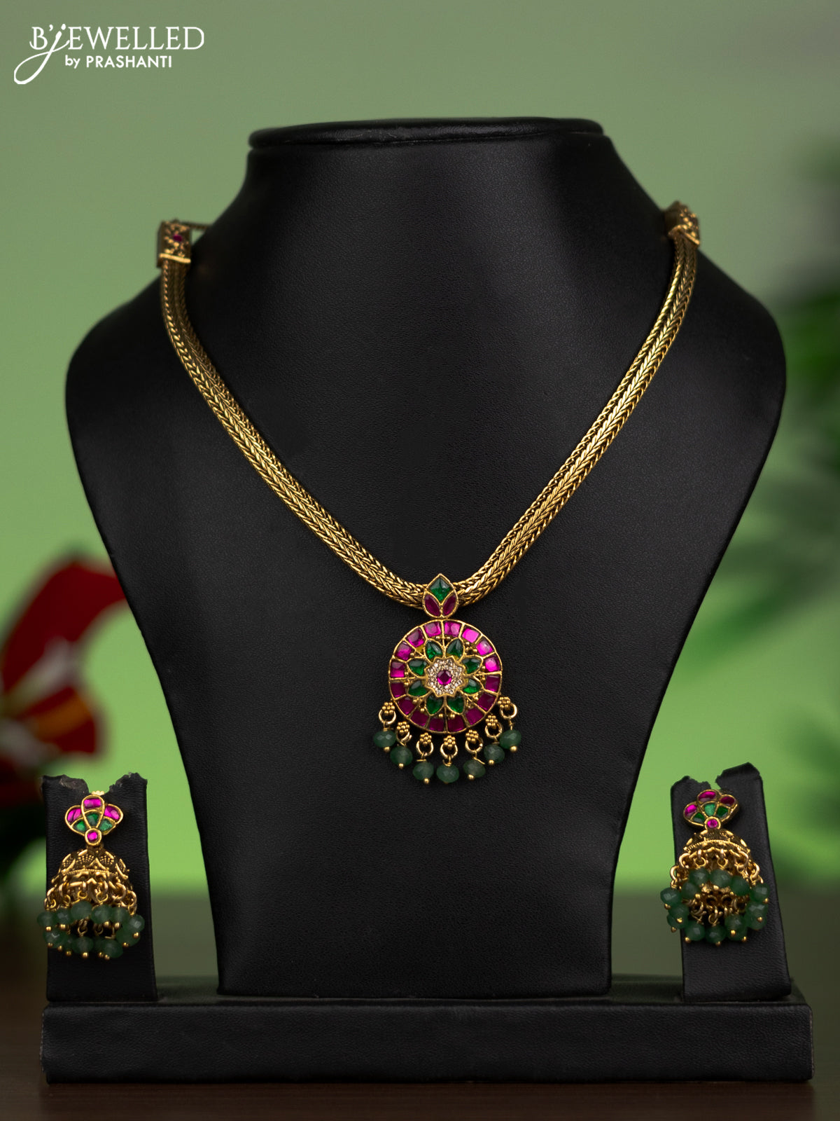 Jadau attigai necklace with jadau stones and green beads hanging