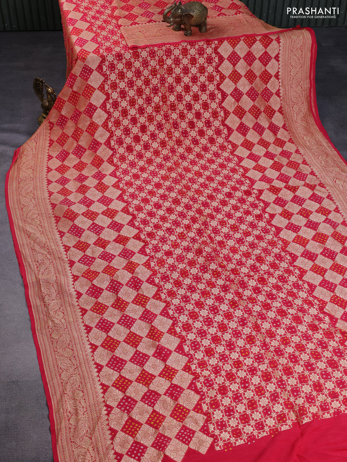 Banarasi georgette saree reddish pink with bandhani prints & zari weaves and woven border