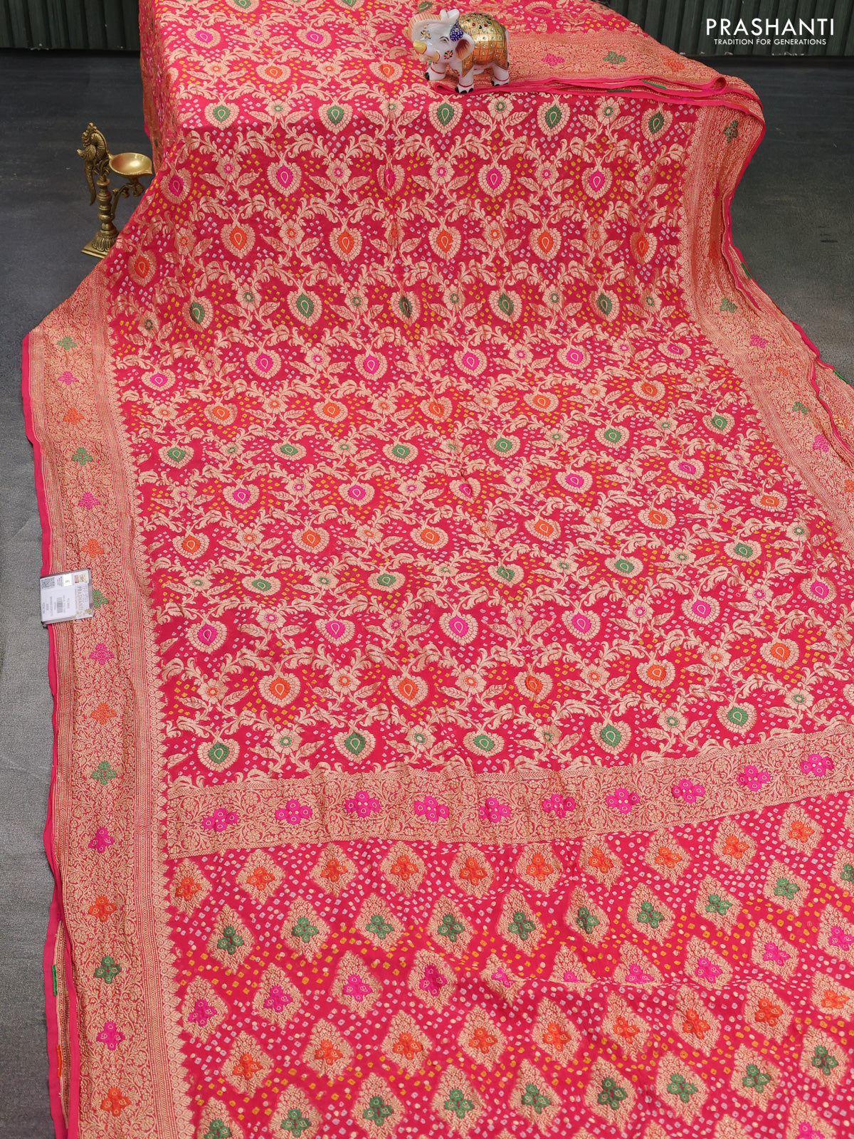 Banarasi georgette saree peach pink with bandhani prints & mina weaves and woven border