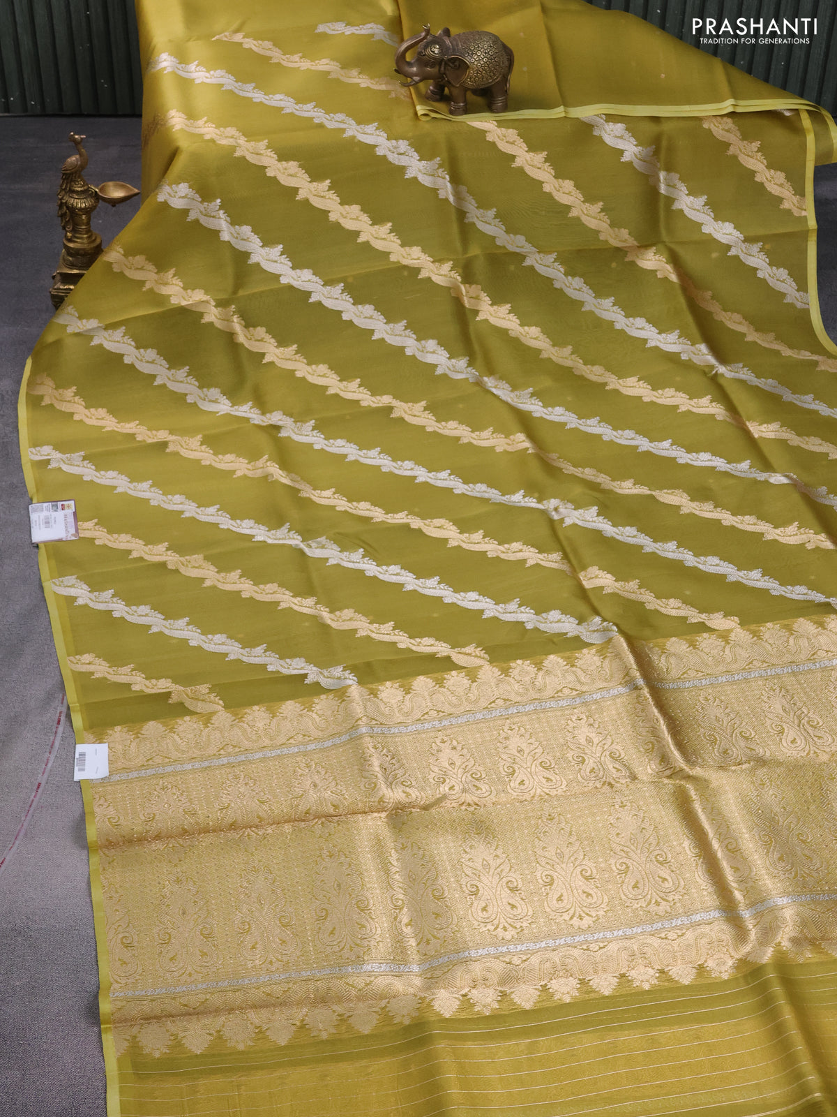 Banarasi organza silk saree mustard green with silver & gold zari weaves and piping border