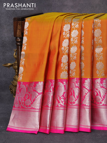 Venkatagiri silk saree dual shade of mustard yellow and pink with allover floral silver zari woven weaves and long peacock design silver zari woven border