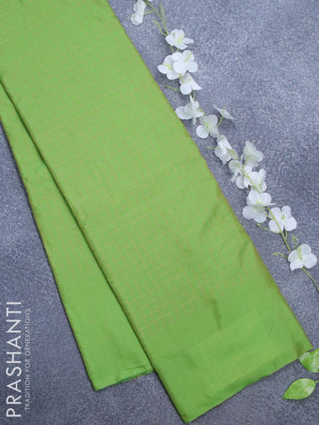 Arani semi silk saree green with allover copper zari checked pattern and simple border