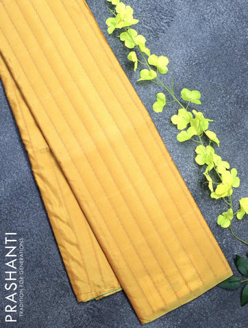 Arani semi silk saree yellow shade and light green with allover copper zari weaves in borderless style