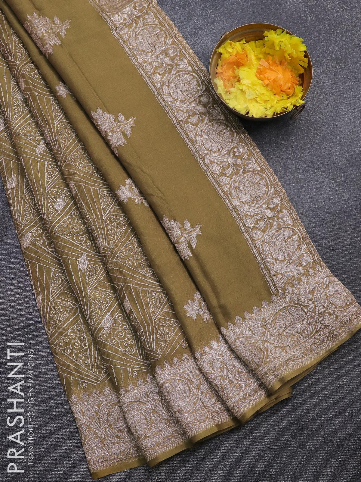 Dark green chiffon saree with zari buttas on its body, zari border of  traditional designs & pallu of intricate designs