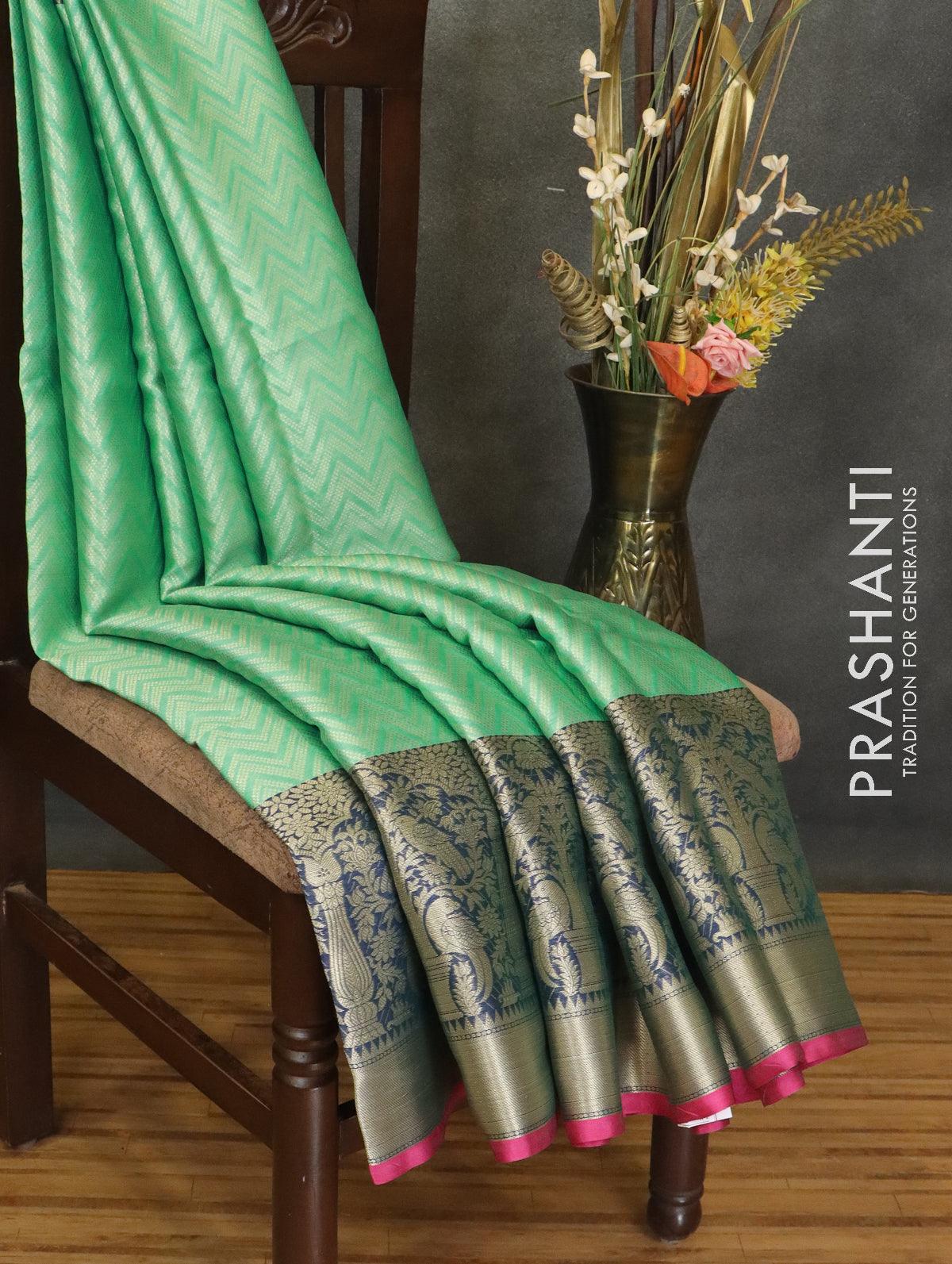 Banarasi kora saree teal green and pink with allover zig zag zari weaves and long zari woven border