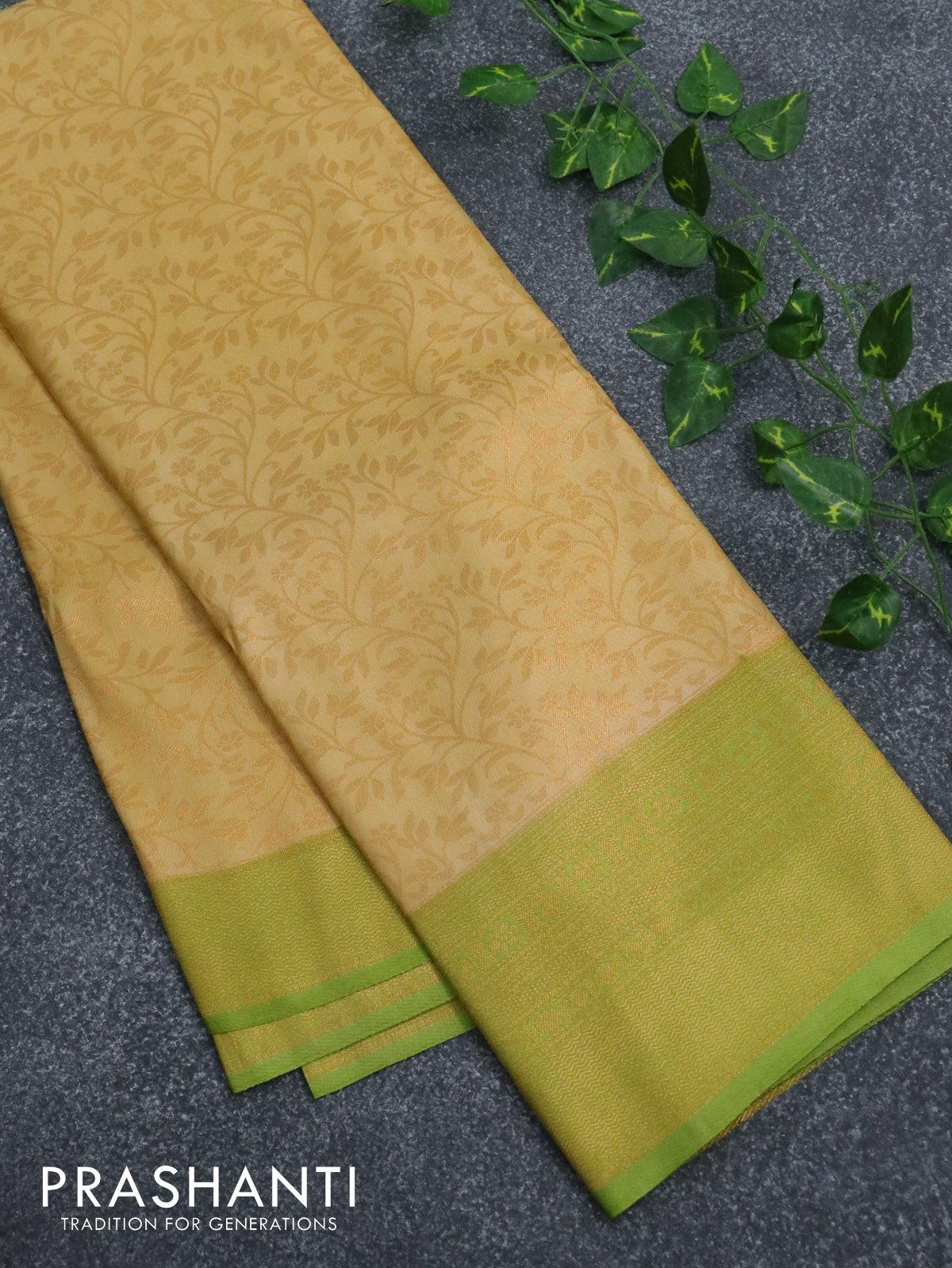 Banarasi semi silk saree sandal and light green with allover zari weaves and zari woven border