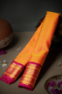 Varamahalakshmi Mustard & Magenta Gadwal Buttis Saree